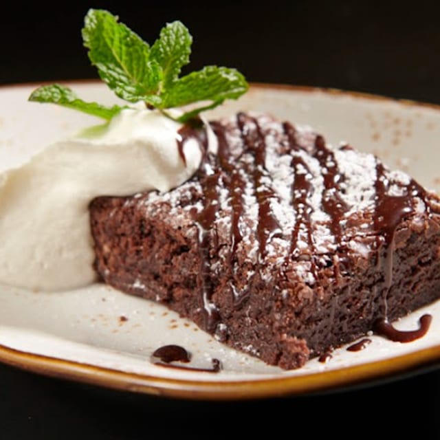 Chocolate fudge brownie, whipped cream.
